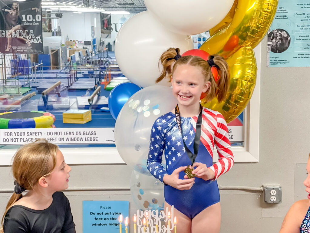 birthday party girl with medal